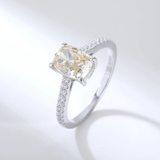S925 sterling silver ring featuring a warm champagne elongated cushion-cut moissanite center stone on a brilliant sparkling moissanite wedding band.