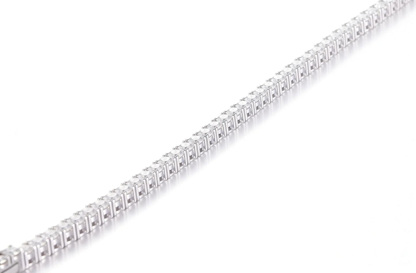 S925 sterling silver tennis bracelet featuring a continuous line of 2.0mm round brilliant white moissanite gemstones with a secure box clasp.