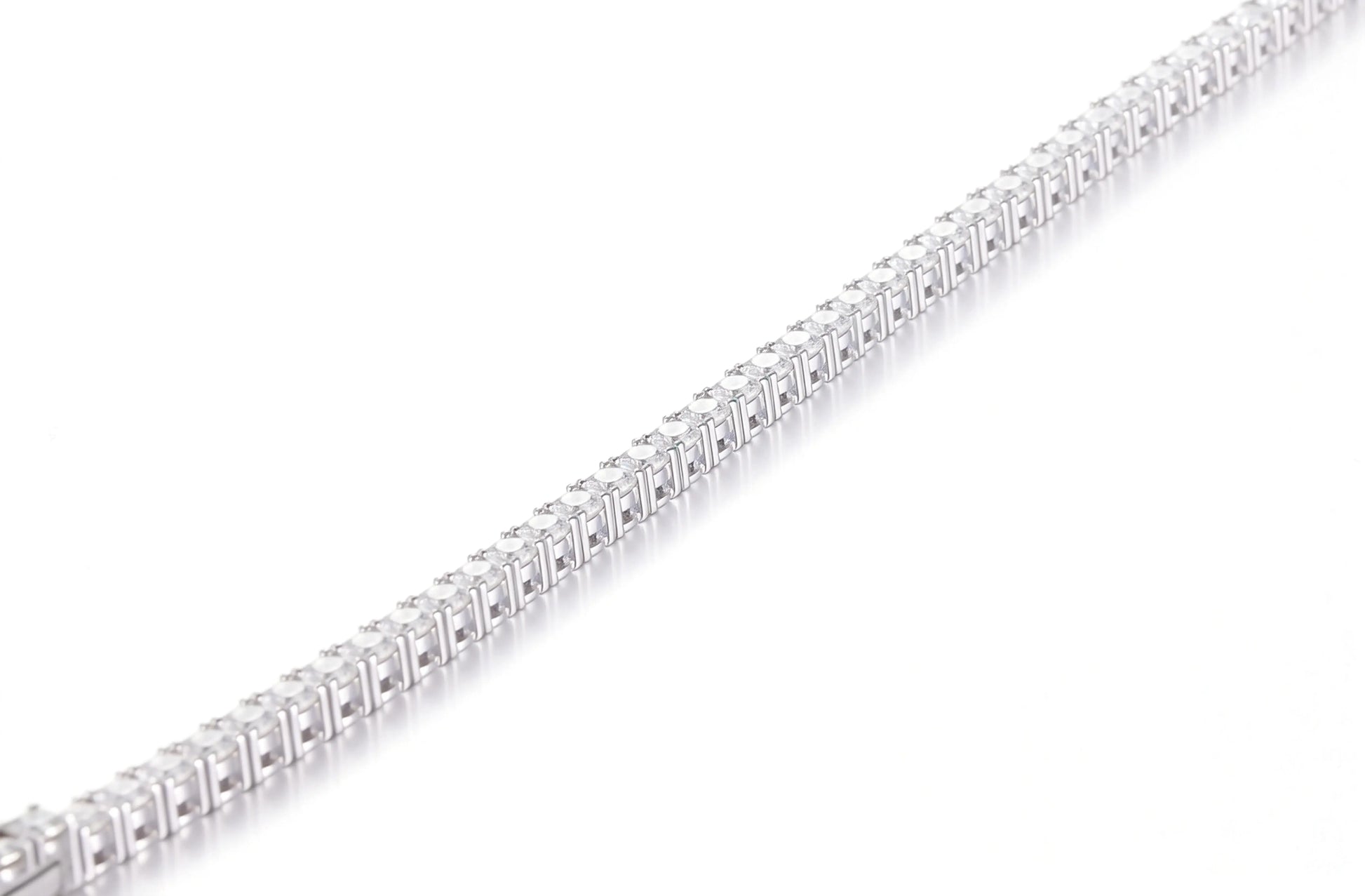 S925 sterling silver tennis bracelet featuring a continuous line of 2.0mm round brilliant white moissanite gemstones with a secure box clasp.