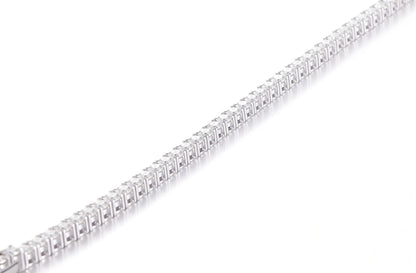 S925 sterling silver tennis bracelet featuring a continuous line of 2.0mm round brilliant white moissanite gemstones with a secure box clasp.