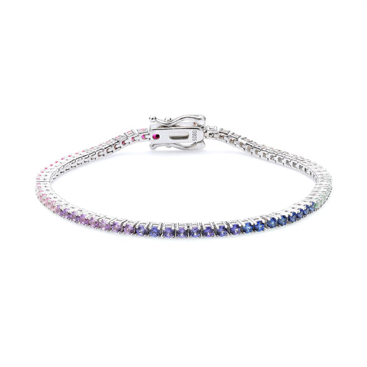 S925 sterling silver tennis bracelet featuring a continuous gradient line of 2.0mm round cut colorful rainbow sapphires with a secure box clasp.