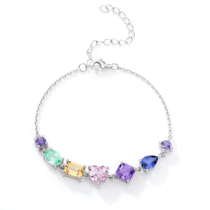 S925 sterling silver chain bracelet featuring seven multi-color and fancy-cut gemstones including heart, pear, emerald, and round shapes.