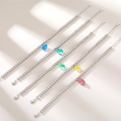 S925 sterling silver beaded bracelet featuring polished round silver beads and a translucent yellow sapphire freeform pendant charm.