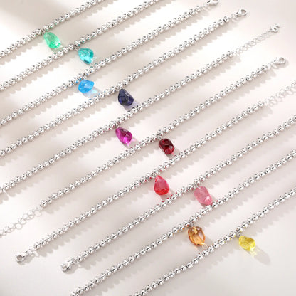 S925 sterling silver beaded bracelet featuring polished round silver beads and a translucent yellow sapphire freeform pendant charm.