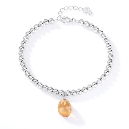 S925 sterling silver beaded bracelet featuring polished round silver beads and a warm champagne sapphire freeform pendant charm.