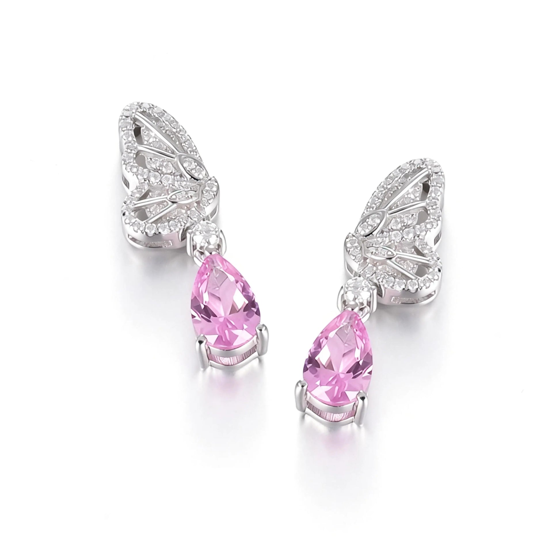 Elegant sterling silver dangle earrings featuring detailed pavé butterfly wings holding vibrant pear-cut pink sapphire stones that catch the light beautifully.