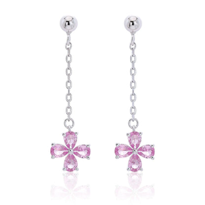 A pair of sterling silver drop stud earrings featuring a shimmering four-leaf clover charm made of four pear-cut pink sapphire gemstones, suspended from a delicate silver chain.
