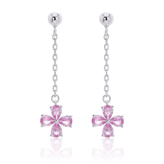 A pair of sterling silver drop stud earrings featuring a shimmering four-leaf clover charm made of four pear-cut pink sapphire gemstones, suspended from a delicate silver chain.