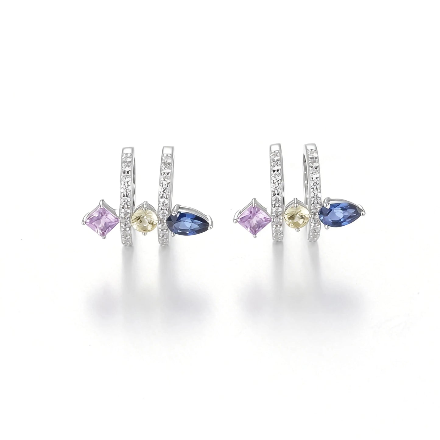 S925 sterling silver double row huggie hoop earrings featuring three geometric gemstones—a blue pear-cut, yellow round-cut, and purple princess-cut stone—with sparkling micro-pavé accents, creating a multi-piercing illusion.