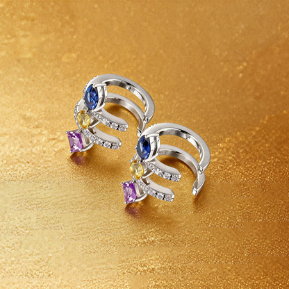 S925 sterling silver double row huggie hoop earrings featuring three geometric gemstones—a blue pear-cut, yellow round-cut, and purple princess-cut stone—with sparkling micro-pavé accents, creating a multi-piercing illusion.