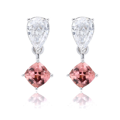 S925 sterling silver drop earrings featuring a sparkling white pear-cut moissanite at the post, dangling a square cushion-cut pink sapphire suspended by a minimalist geometric silver loop.
