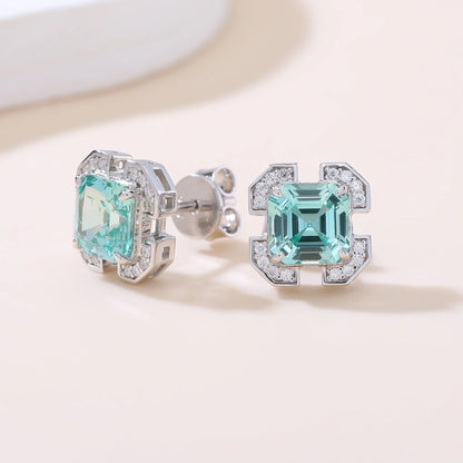 S925 sterling silver geometric stud earrings featuring a square Asscher-cut mint green spinel surrounded by an octagonal frame with pavé moissanite accents.