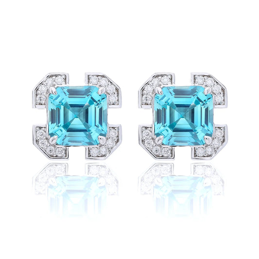 S925 sterling silver geometric stud earrings featuring a square Asscher-cut blue topaz surrounded by an octagonal frame with pavé moissanite accents.