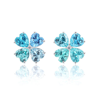 S925 sterling silver stud earrings featuring four heart-cut ocean blue moissanite gemstones forming a lucky four-leaf clover with a sparkling center moissanite.