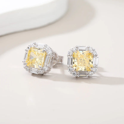 Cushion crushed ice cut canary yellow moissanite stud earrings featuring baguette and round moissanite halo setting.