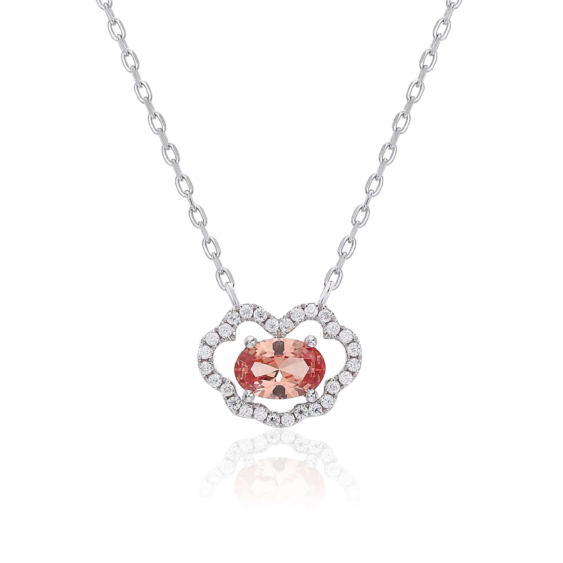 A sterling silver chain necklace featuring a traditional Chinese auspicious Ruyi cloud pendant, encrusted with pavé accents and centered with an oval-cut padparadscha sapphire.