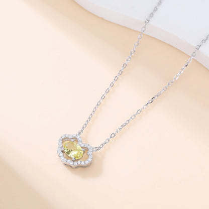 A sterling silver chain necklace featuring a traditional Chinese auspicious Ruyi cloud pendant, encrusted with shimmering pavé accents and centered with an oval-cut yellow moissanite gemstone.
