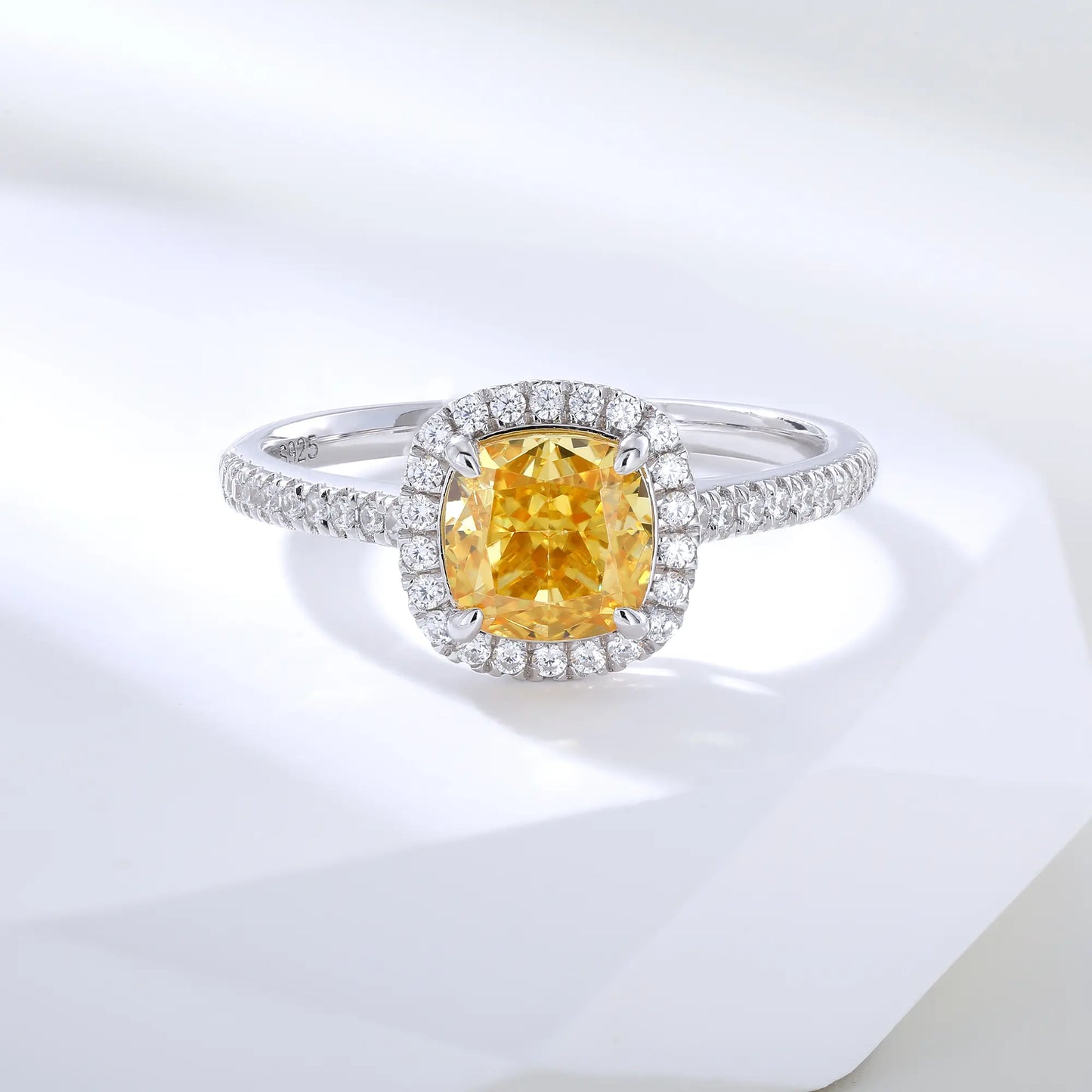 S925 sterling silver ring featuring a square cushion-cut yellow moissanite center stone surrounded by a sparkling moissanite halo and pavé band.