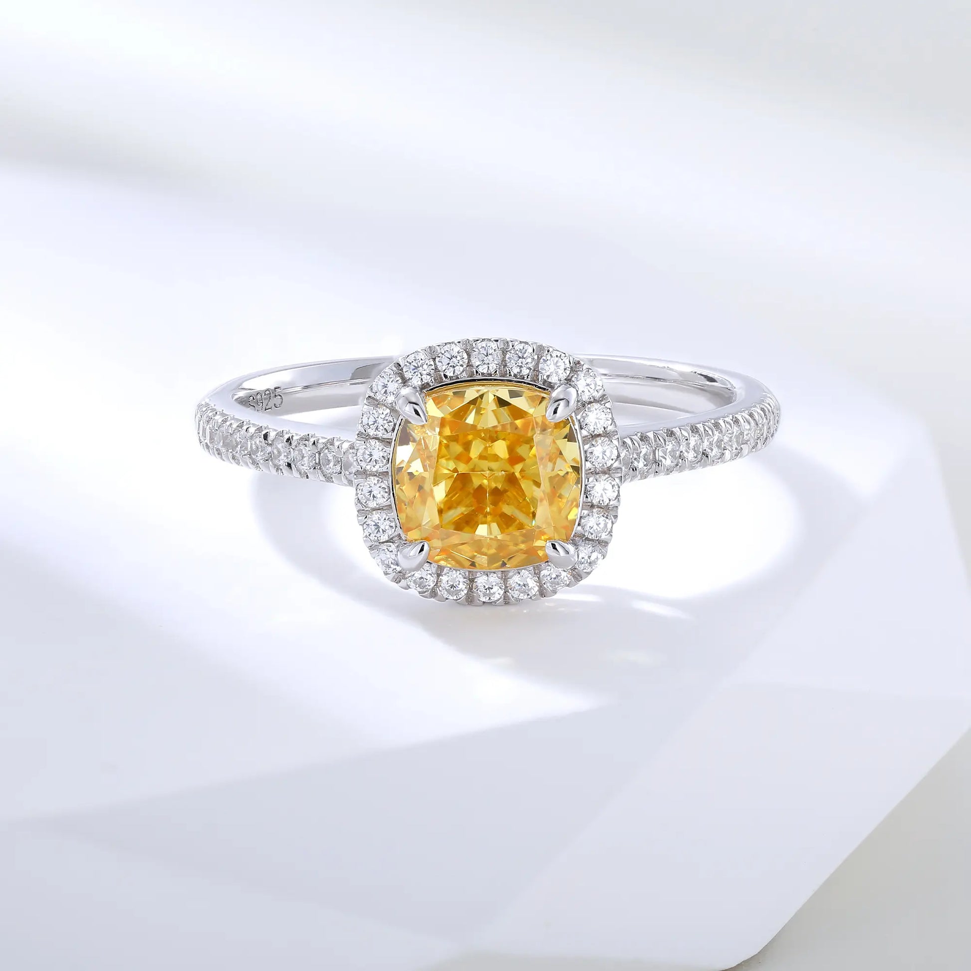 S925 sterling silver ring featuring a square cushion-cut yellow moissanite center stone surrounded by a sparkling moissanite halo and pavé band.