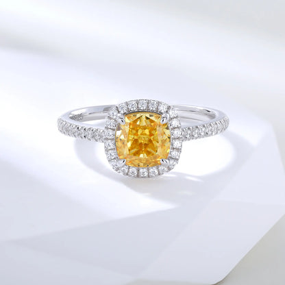 S925 sterling silver ring featuring a square cushion-cut yellow moissanite center stone surrounded by a sparkling moissanite halo and pavé band.