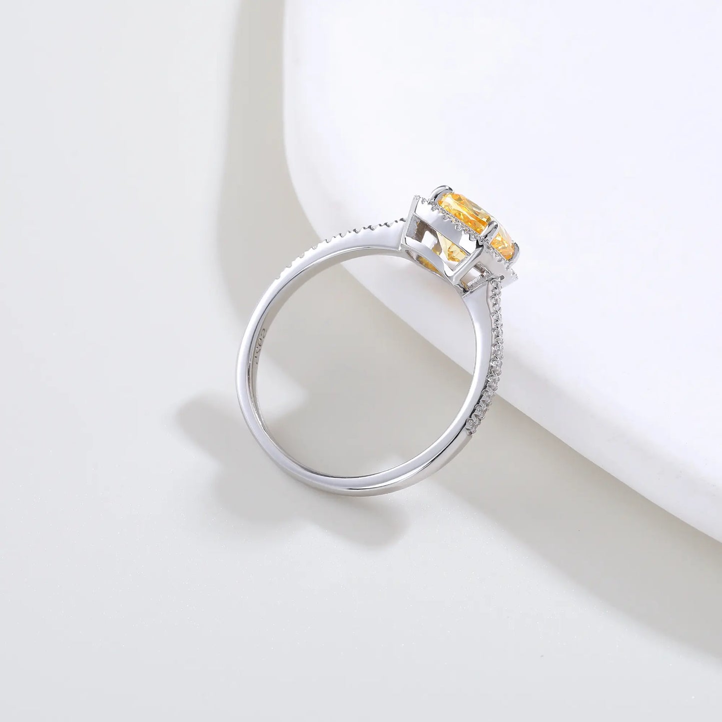 S925 sterling silver ring featuring a square cushion-cut yellow moissanite center stone surrounded by a sparkling moissanite halo and pavé band.