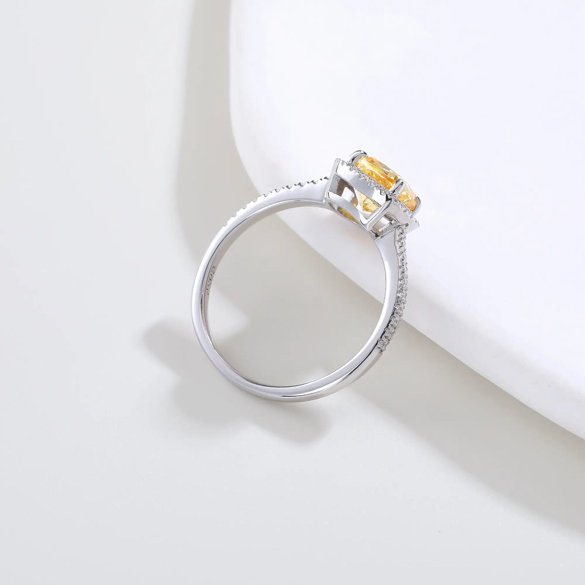 S925 sterling silver ring featuring a square cushion-cut yellow moissanite center stone surrounded by a sparkling moissanite halo and pavé band.