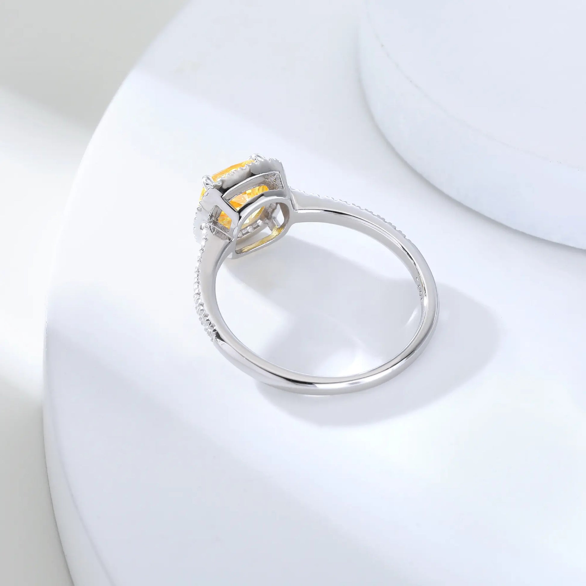 S925 sterling silver ring featuring a square cushion-cut yellow moissanite center stone surrounded by a sparkling moissanite halo and pavé band.