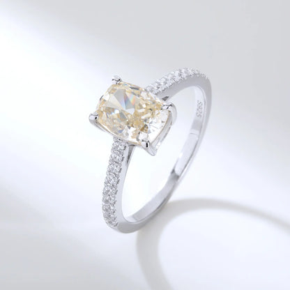 S925 sterling silver ring featuring a warm champagne elongated cushion-cut moissanite center stone on a brilliant sparkling moissanite wedding band.