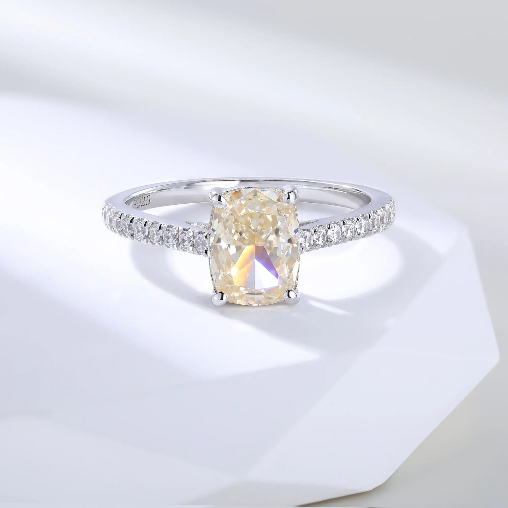 S925 sterling silver ring featuring a warm champagne elongated cushion-cut moissanite center stone on a brilliant sparkling moissanite wedding band.