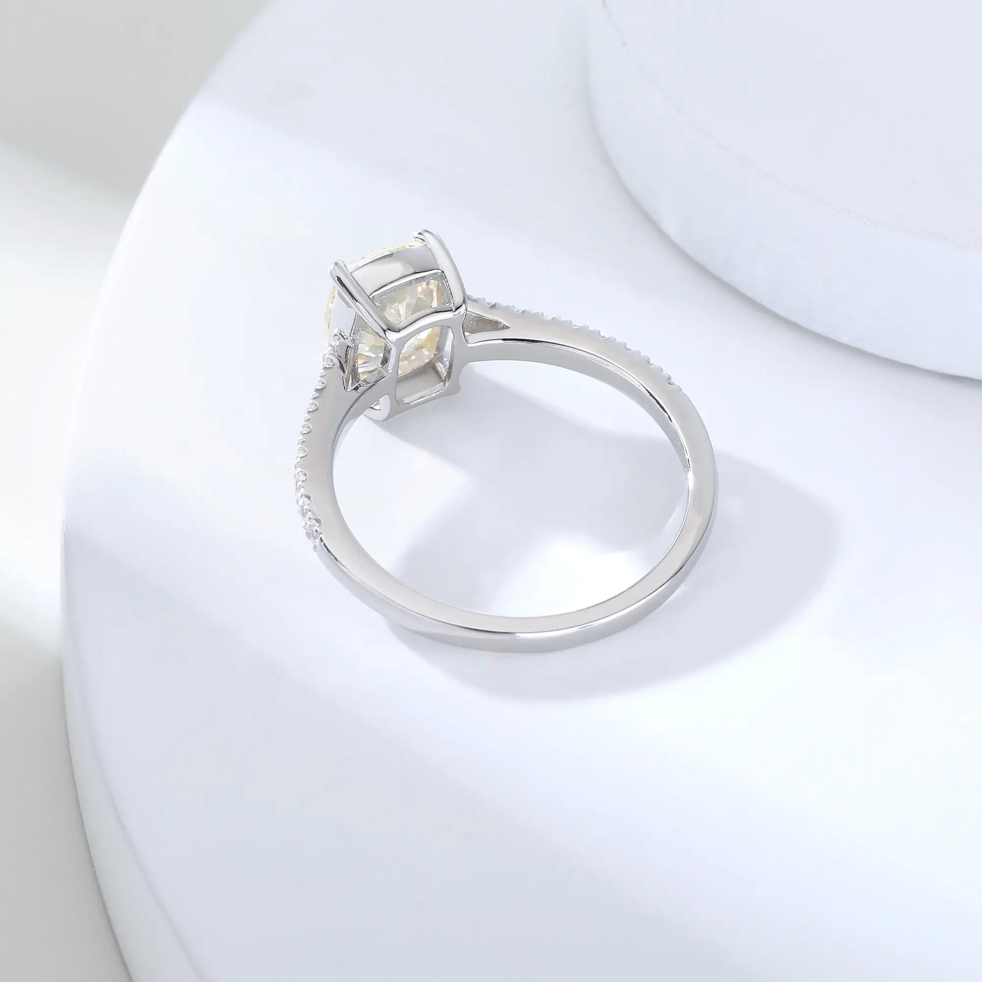 S925 sterling silver ring featuring a warm champagne elongated cushion-cut moissanite center stone on a brilliant sparkling moissanite wedding band.