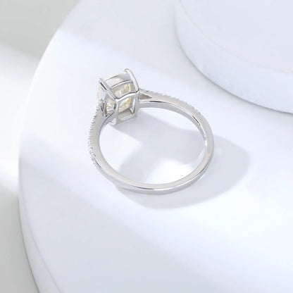S925 sterling silver ring featuring a warm champagne elongated cushion-cut moissanite center stone on a brilliant sparkling moissanite wedding band.