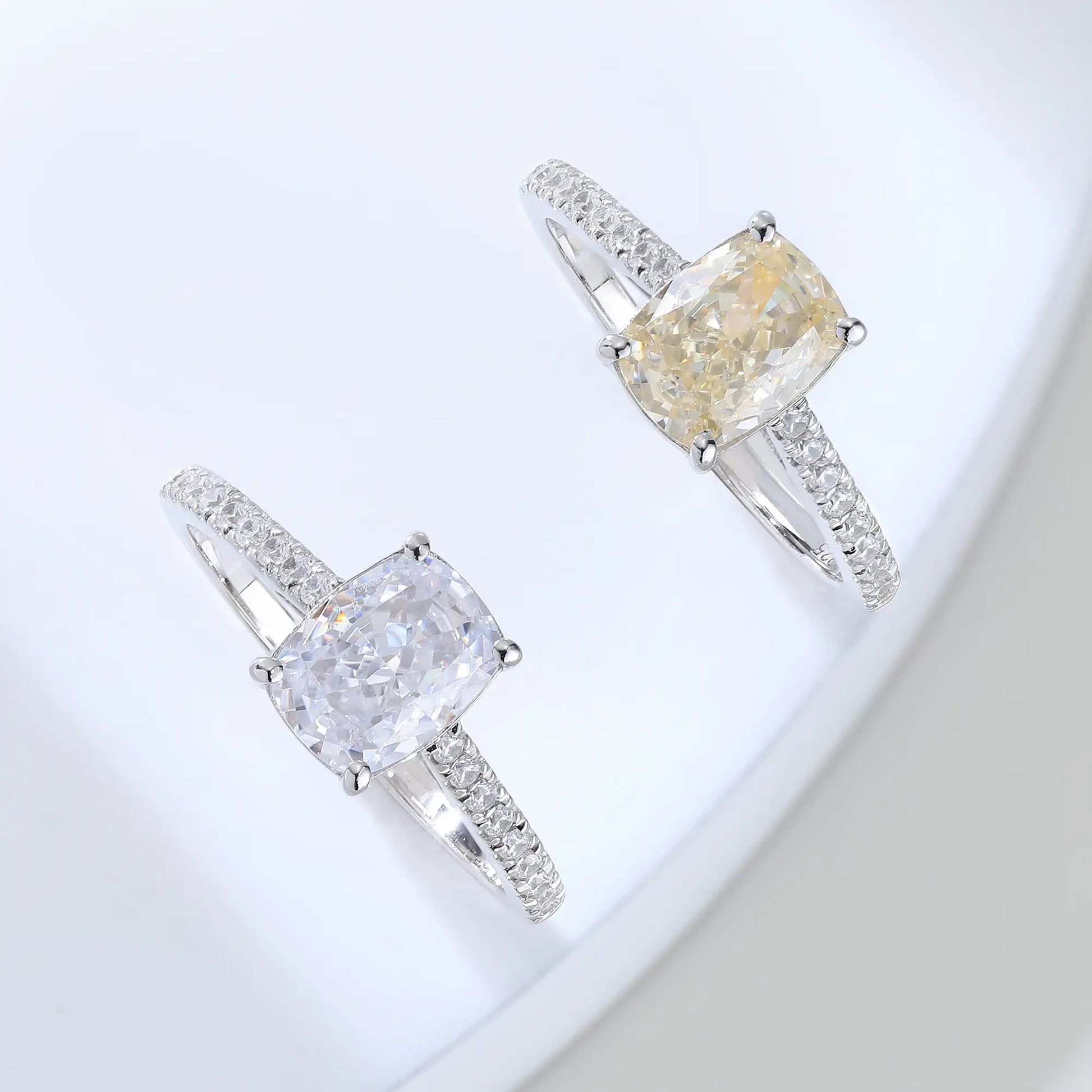 S925 sterling silver ring featuring a warm champagne elongated cushion-cut moissanite center stone on a brilliant sparkling moissanite wedding band.