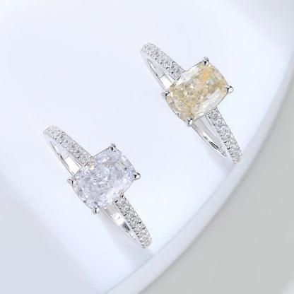 S925 sterling silver ring featuring a warm champagne elongated cushion-cut moissanite center stone on a brilliant sparkling moissanite wedding band.
