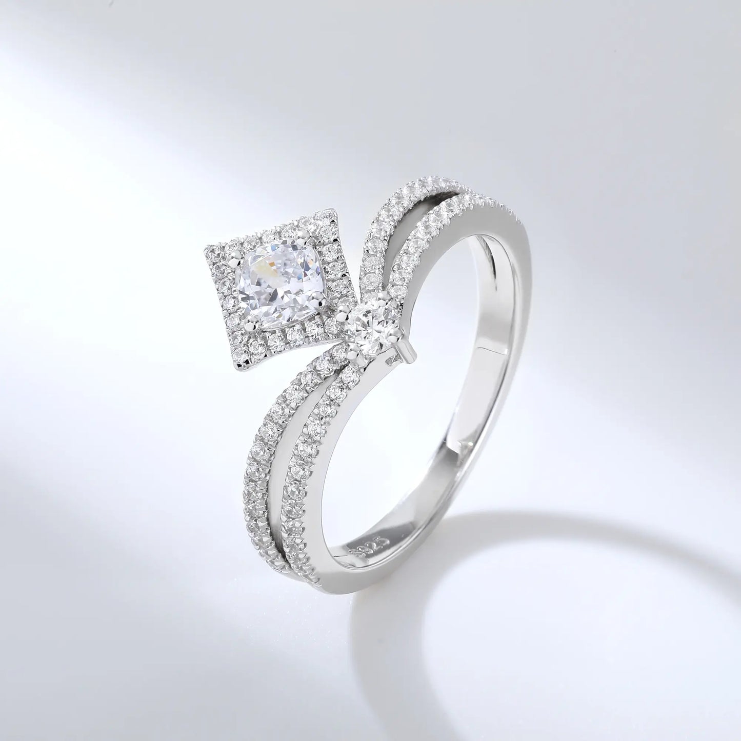S925 sterling silver tiara ring featuring a square cushion-cut moissanite center stone set in a diamond-shaped halo on a curved double-row pavé crown band.