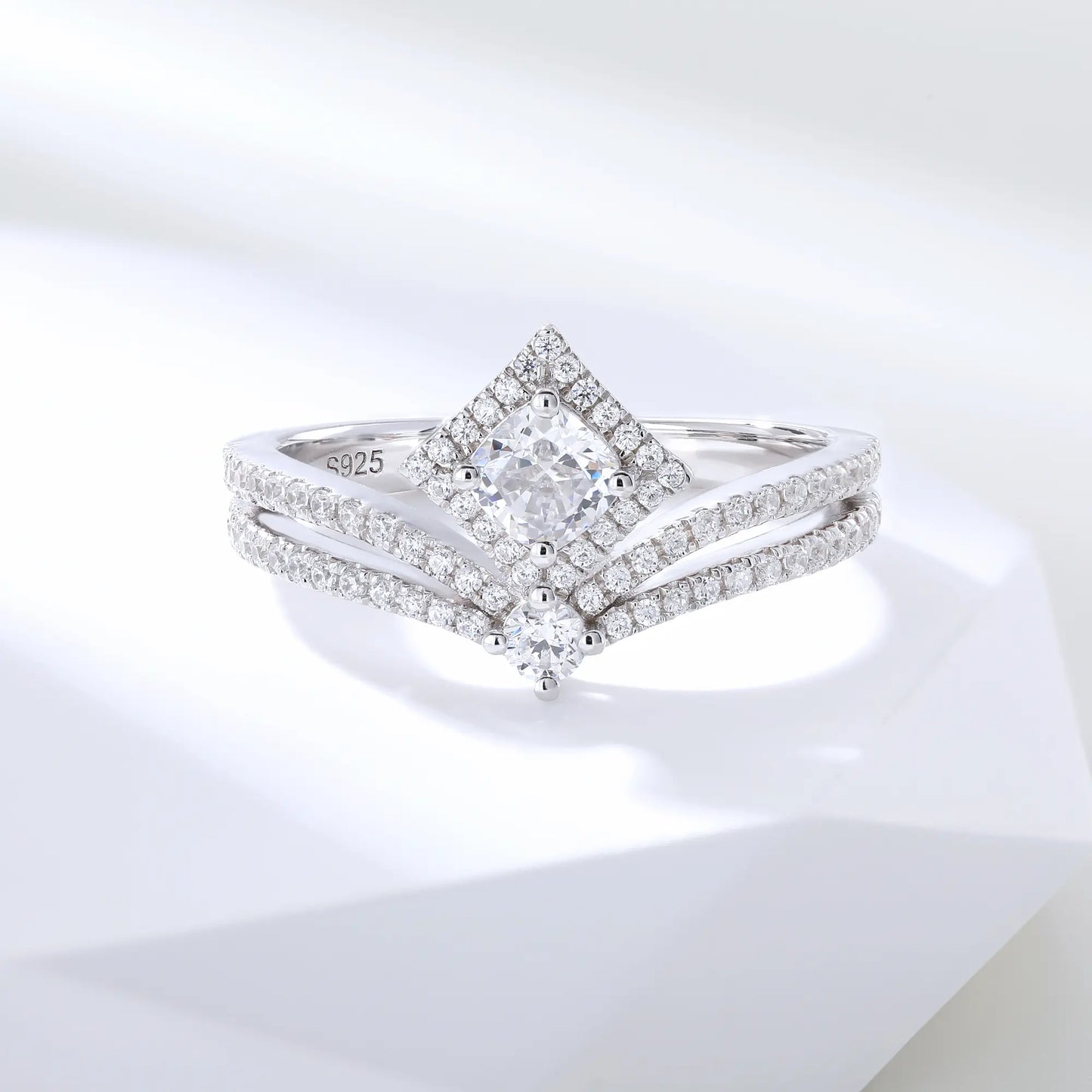 S925 sterling silver tiara ring featuring a square cushion-cut moissanite center stone set in a diamond-shaped halo on a curved double-row pavé crown band.