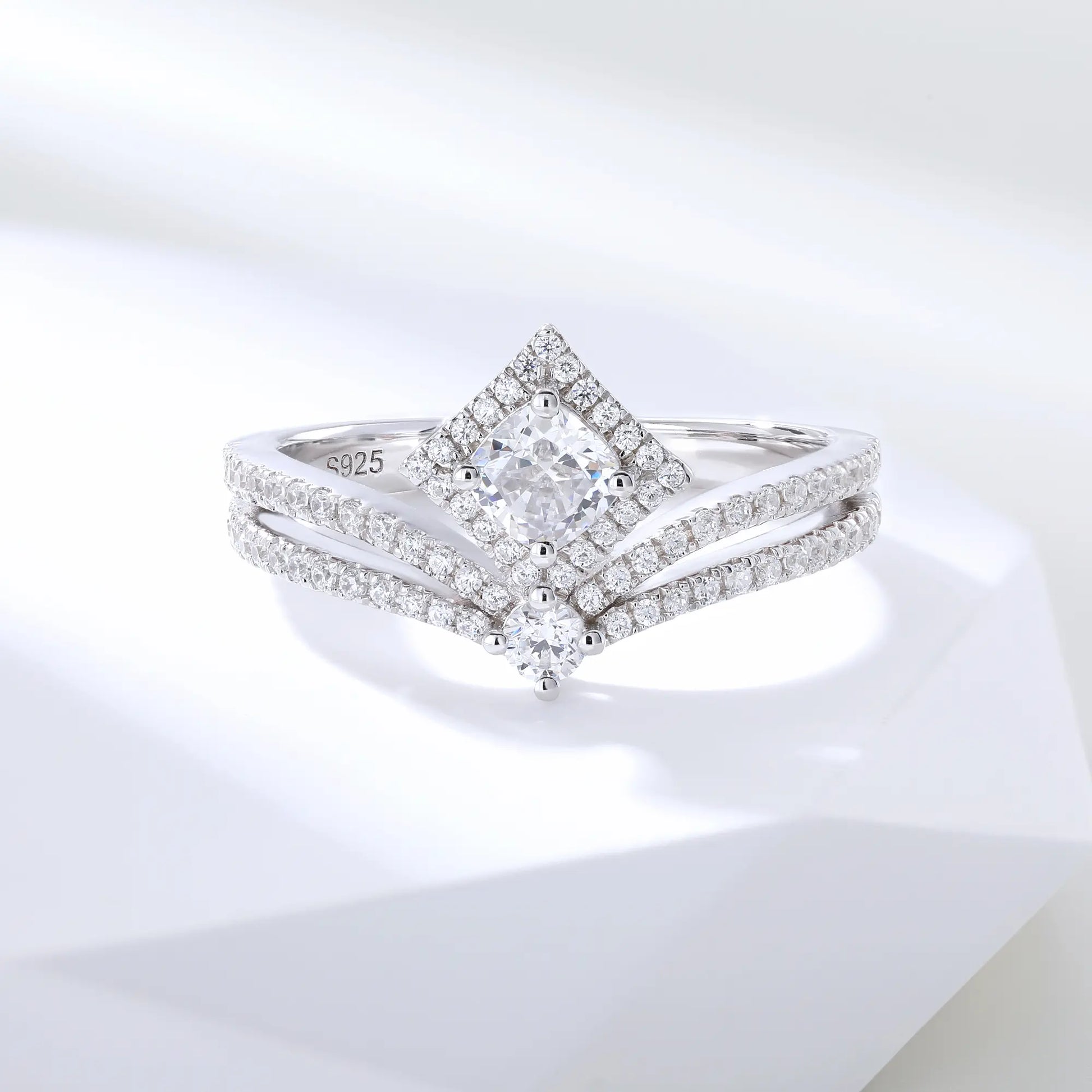 S925 sterling silver tiara ring featuring a square cushion-cut moissanite center stone set in a diamond-shaped halo on a curved double-row pavé crown band.