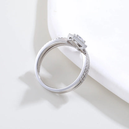 S925 sterling silver tiara ring featuring a square cushion-cut moissanite center stone set in a diamond-shaped halo on a curved double-row pavé crown band.