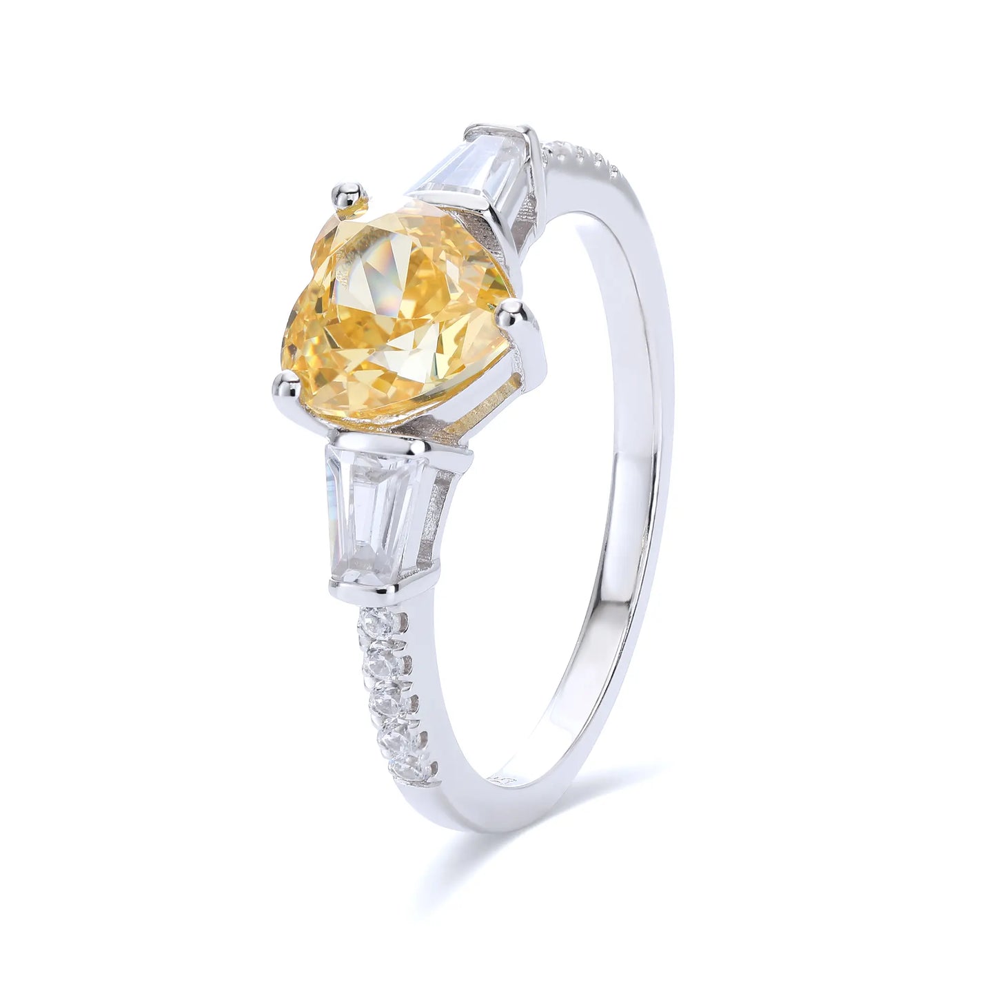 S925 sterling silver three-stone ring featuring a heart-cut yellow sapphire center stone flanked by tapered baguette cut moissanites on a pavé band.