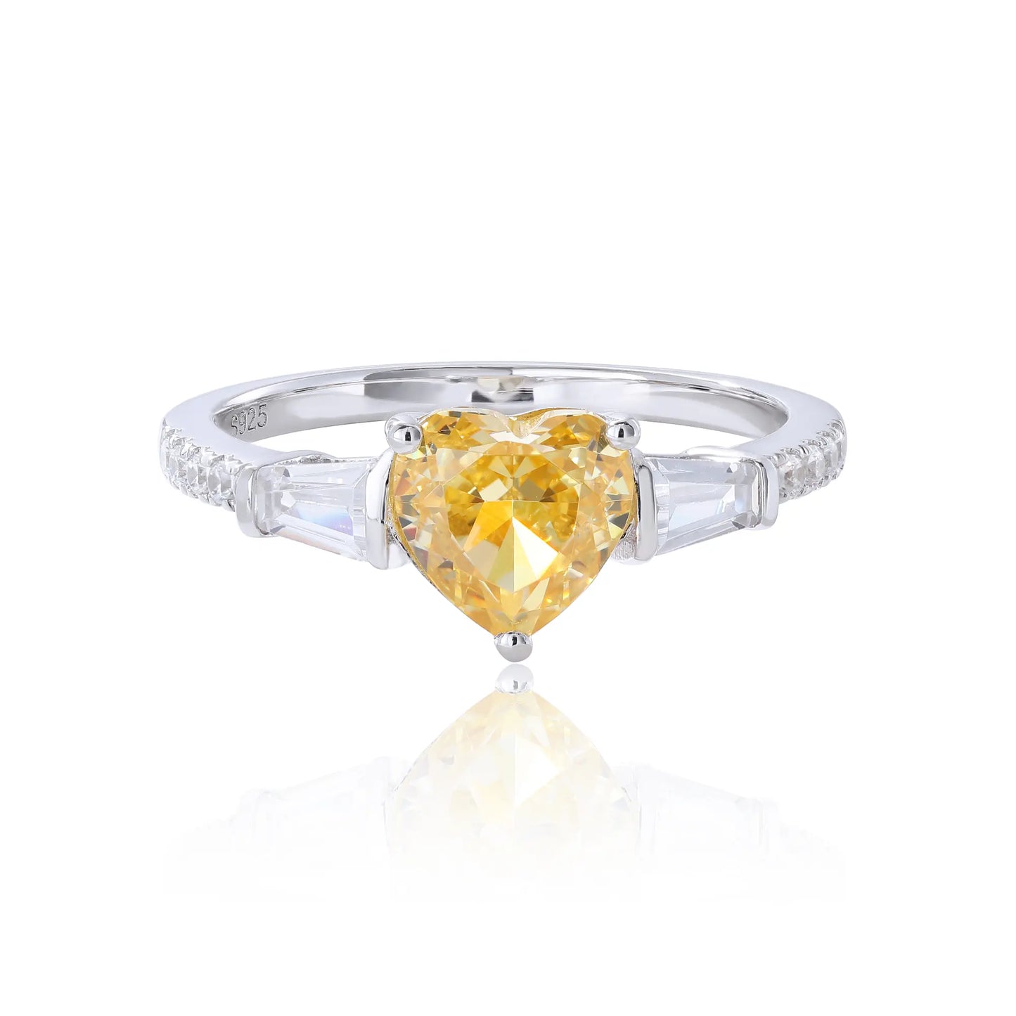 S925 sterling silver three-stone ring featuring a heart-cut yellow sapphire center stone flanked by tapered baguette cut moissanites on a pavé band.