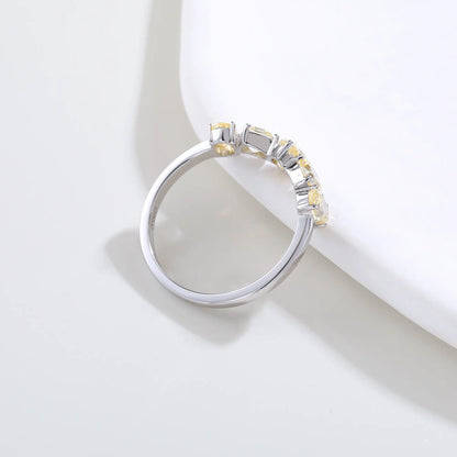 S925 sterling silver five-stone ring featuring fancy multi-shape yellow moissanites including pear, cushion, and oval cuts in a contour band.