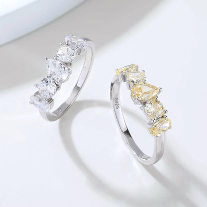 S925 sterling silver five-stone ring featuring fancy multi-shape yellow moissanites including pear, cushion, and oval cuts in a contour band.