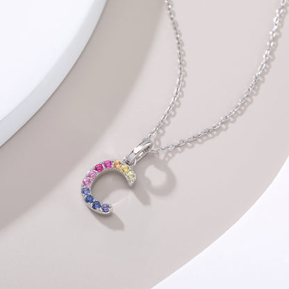 Vibrant multi-color lab-grown sapphire letter C pendant on a sterling silver chain necklace.
