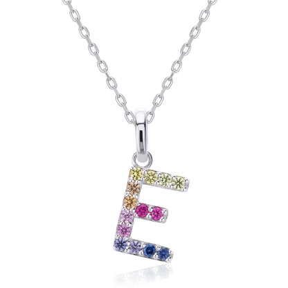 Dainty sterling silver cable chain necklace showcasing a block letter E charm encrusted with a rainbow spectrum of lab-created colored sapphires.