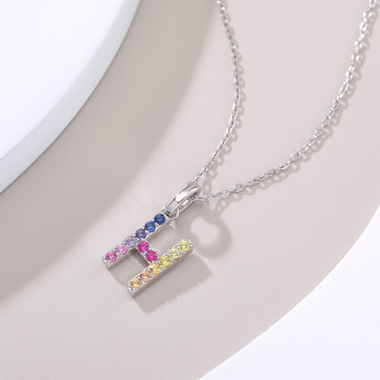 Sterling silver initial necklace featuring a block letter H pendant meticulously set with a multi-color rainbow gradient of round lab sapphires.
