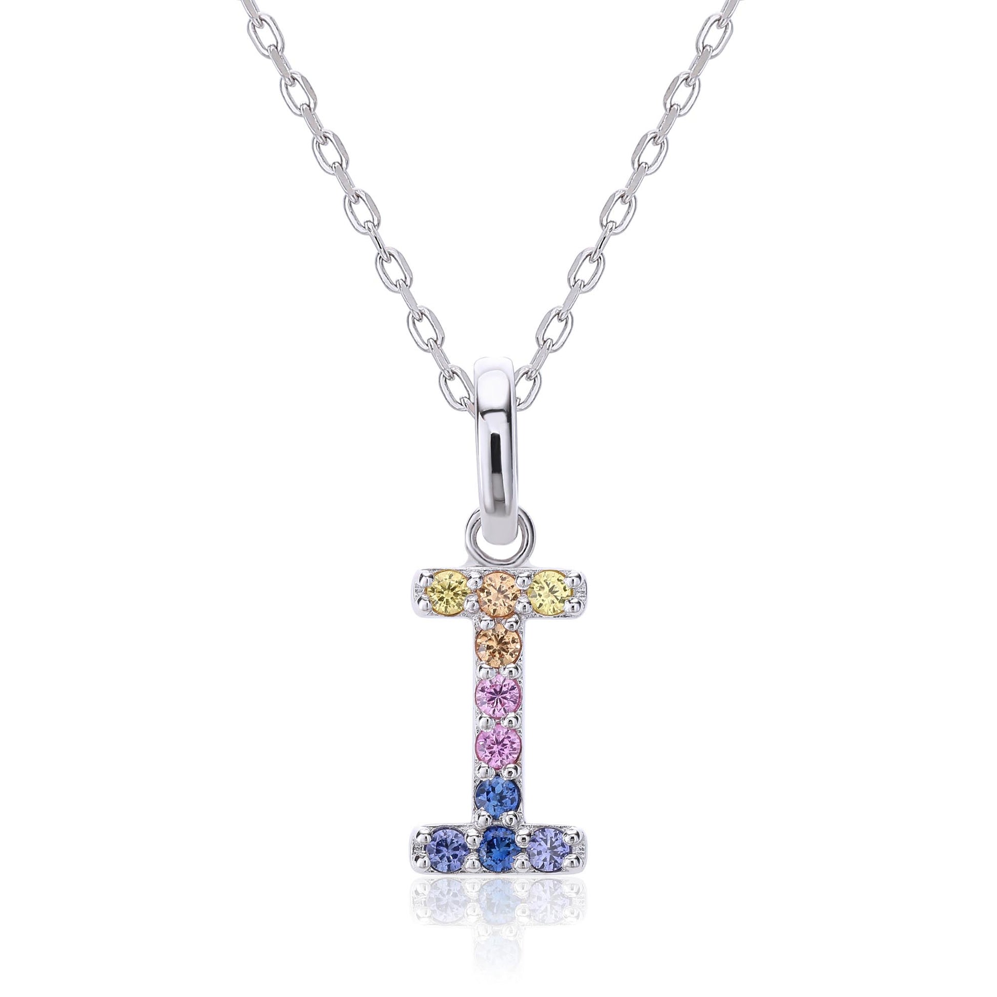 A sleek sterling silver initial necklace showcasing a capital letter I pendant set with a precise vertical rainbow gradient of multi-color lab sapphires.