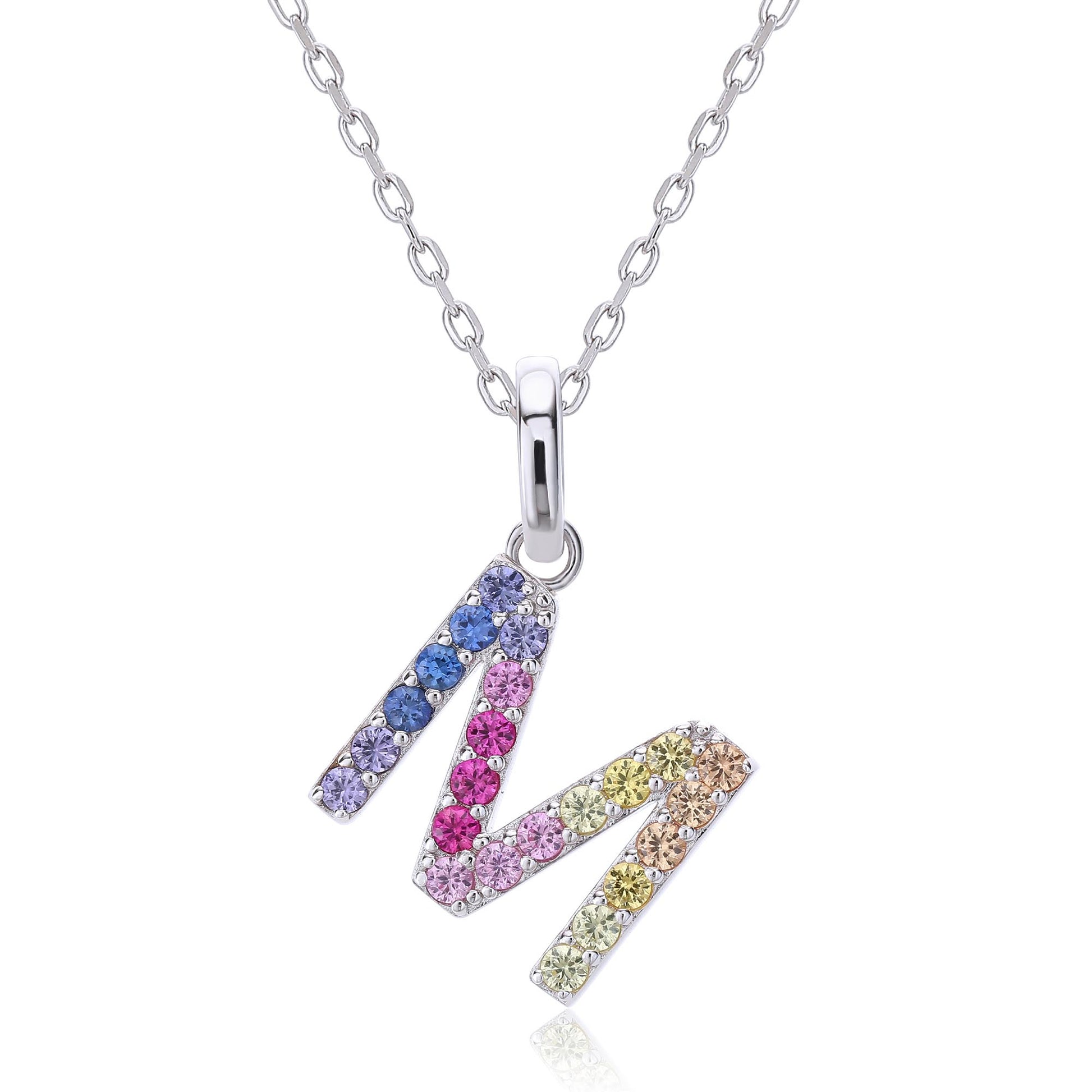 A classic sterling silver initial necklace showcasing an uppercase letter M pendant encrusted with a sweeping zig-zag rainbow gradient of brilliant multi-color lab sapphires.