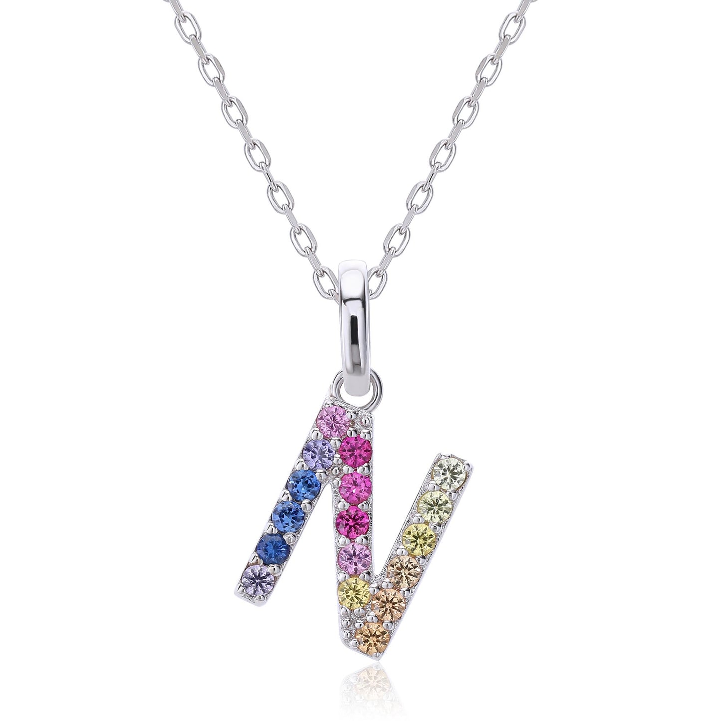 A delicate sterling silver chain necklace holding an uppercase letter N pendant intricately hand-set with a fluid rainbow gradient of multi-color lab sapphires.