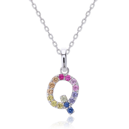 A solid sterling silver necklace displaying an uppercase letter Q monogram pendant, highlighted by a playful tail and handset with a continuous rainbow gradient of round lab sapphires.