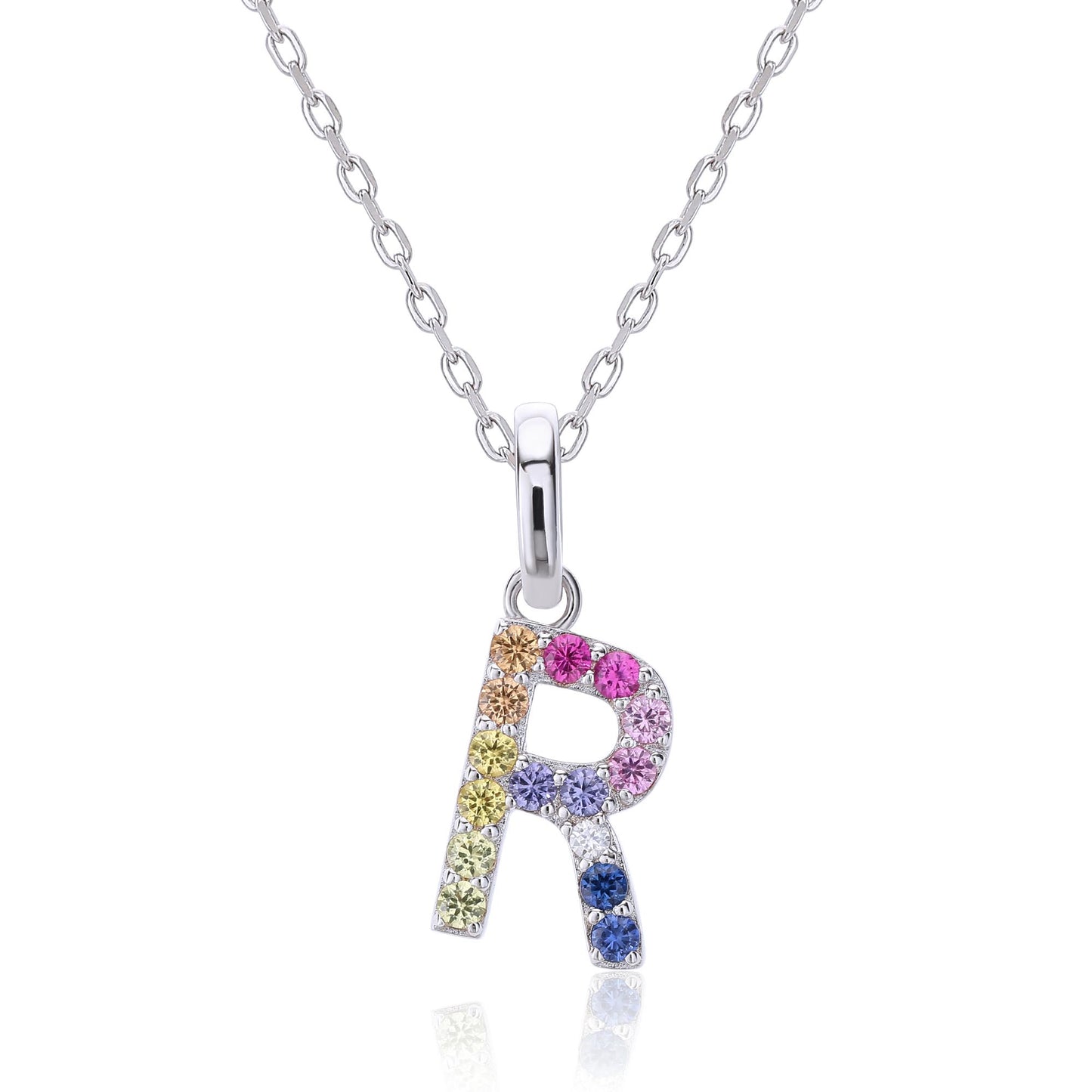 A delicate sterling silver initial necklace holding an uppercase letter R pendant meticulously set with a multi-color rainbow spectrum of round lab sapphires.