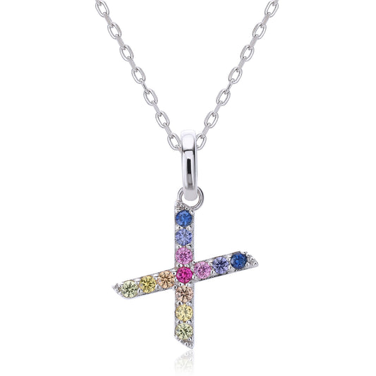 A delicate sterling silver cable chain necklace supporting a bold capital letter X pendant, micro-pave set with a dual-axis intersecting rainbow gradient of multi-color lab sapphires.